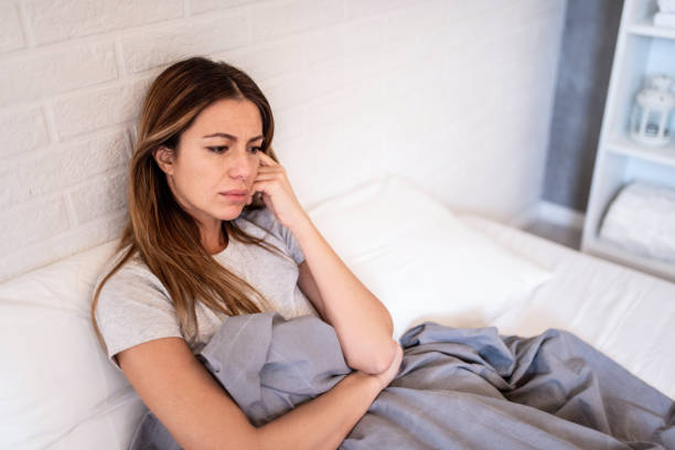 Woman feeling tired at 2 PM due to afternoon cortisol crash