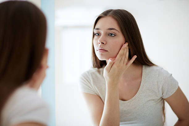 woman checking neck skin changes insulin resistance