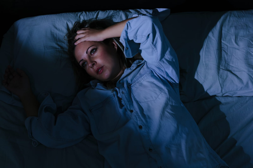 Woman feeling wired but tired at night unable to sleep