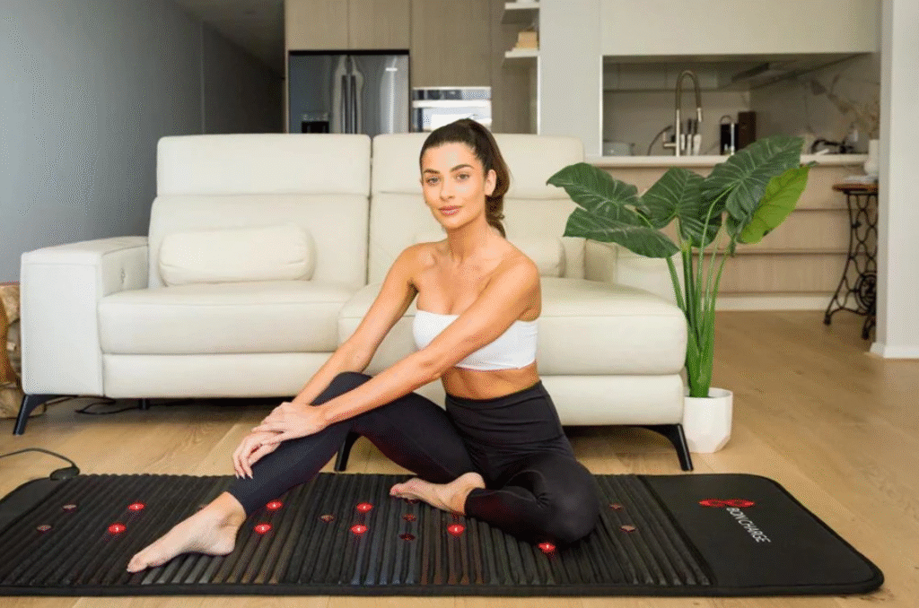 Woman using PEMF therapy mat for stress reduction