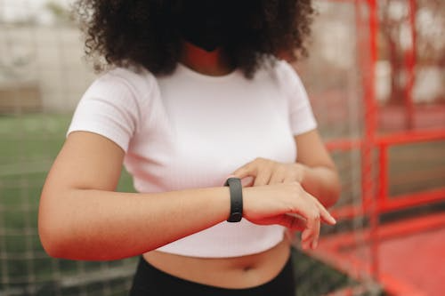 Woman checking health data on a smartwatch